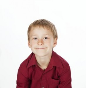 Smiling boy in red shirt